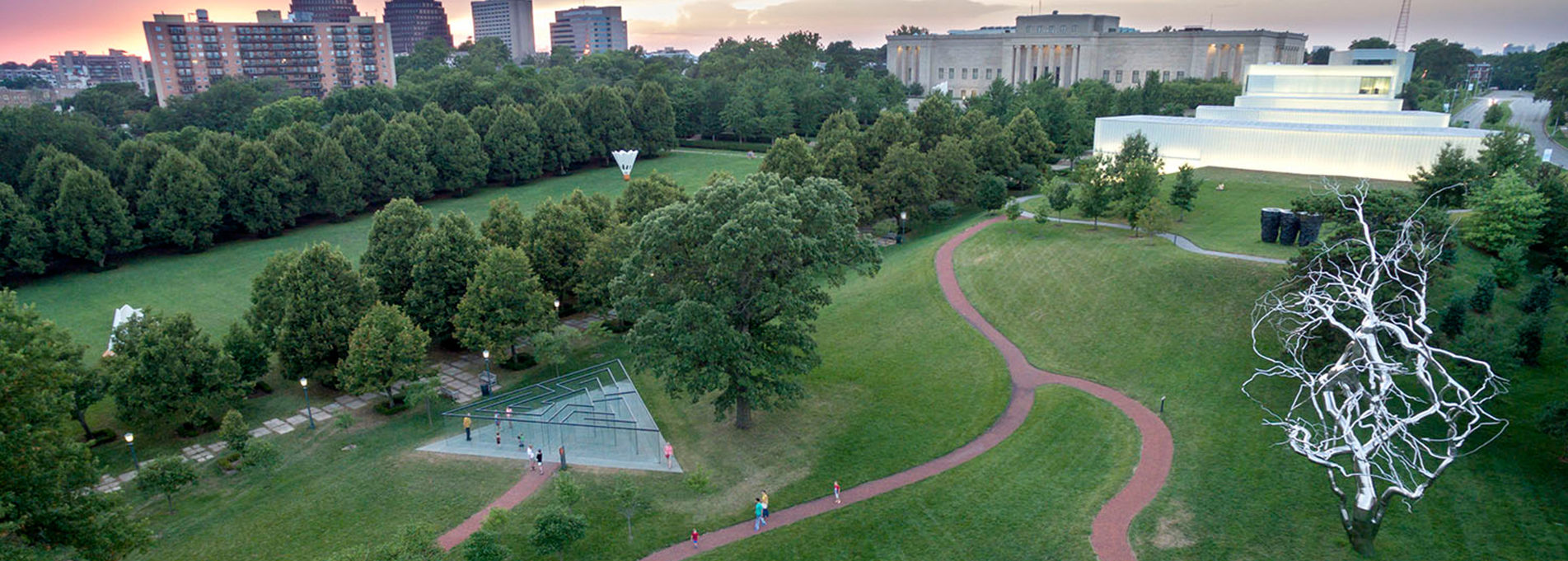 Aerial view of Nelson-Atkin Museum's south lawn in summer. Sculptures of two Shuttlecocks, Glass Labyrinth and stainless steel tree.