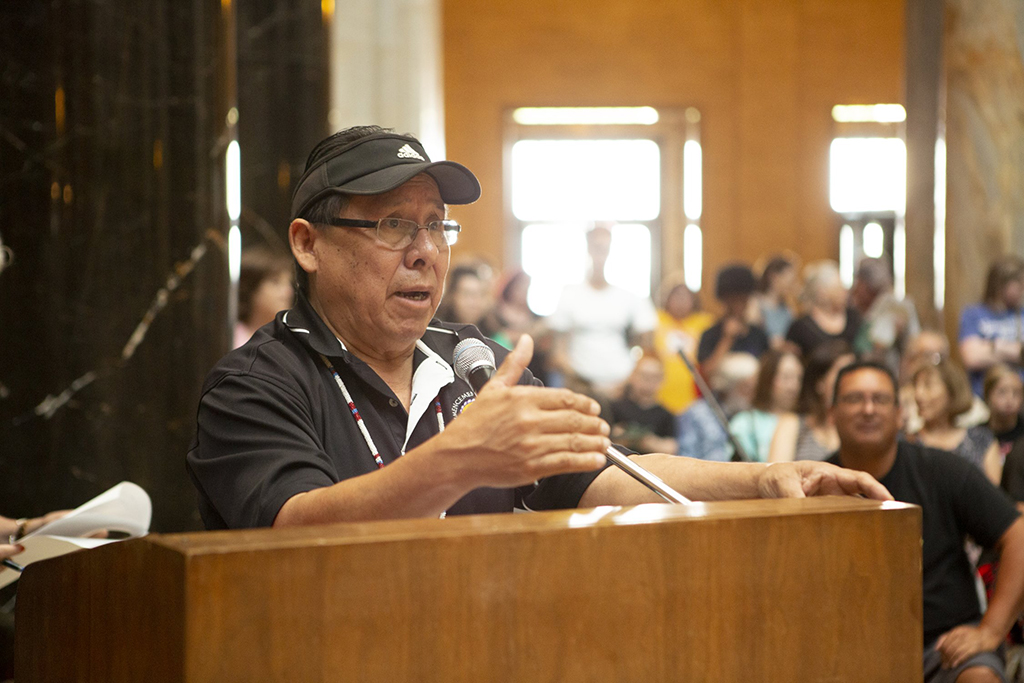 Manny King, Registrar at the Haskell Indian Nations University, delivers opening remarks following the Land Acknowledgment at the Native American Cultural Celebration in 2019.