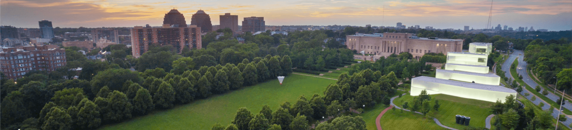 Landscape image of Nelson-Atkins Lawn at dusk