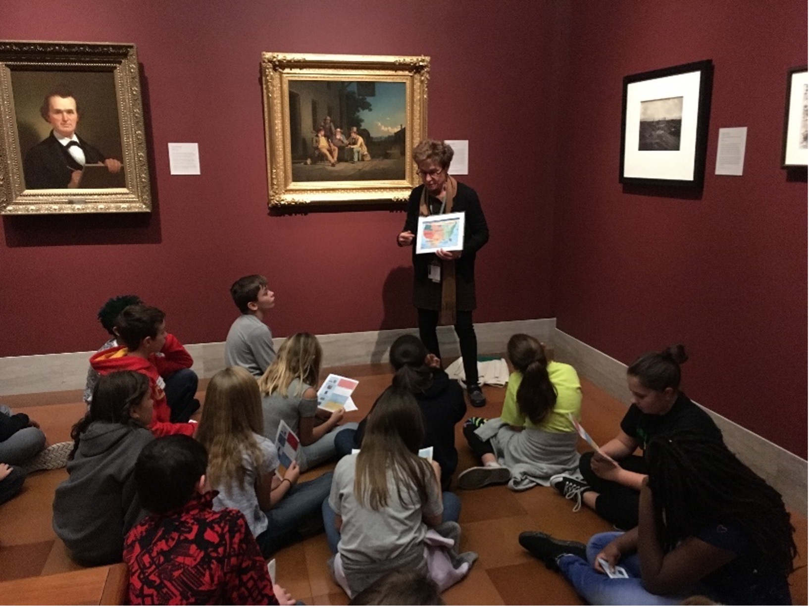 Tour group in red gallery