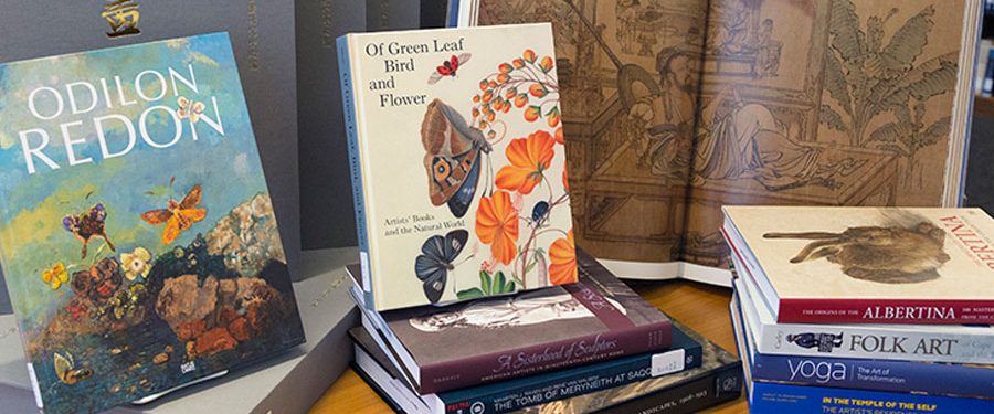 Decorative arrangement of books on a library table