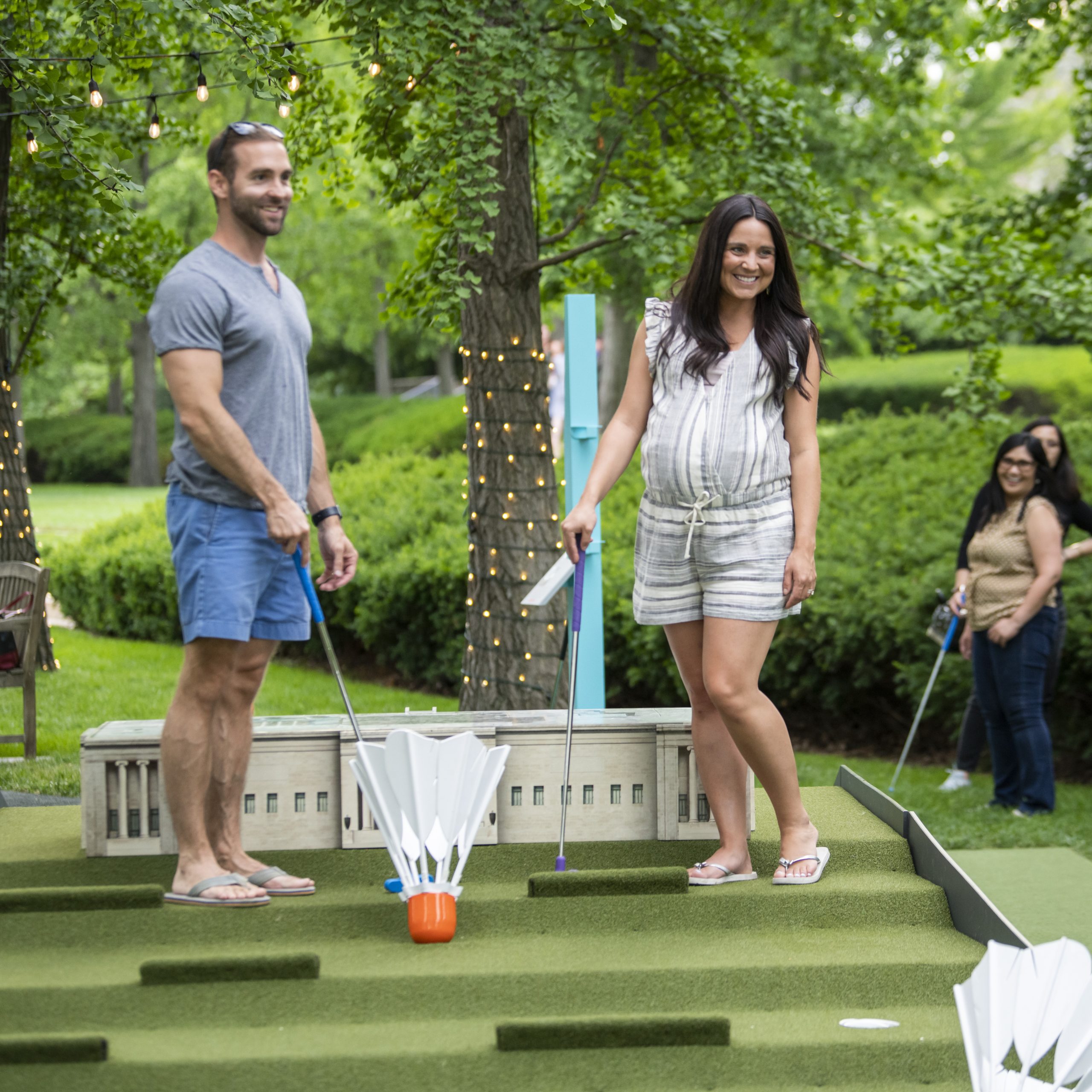 A couple play mini-golf on the Nelson-Atkins Art Course.