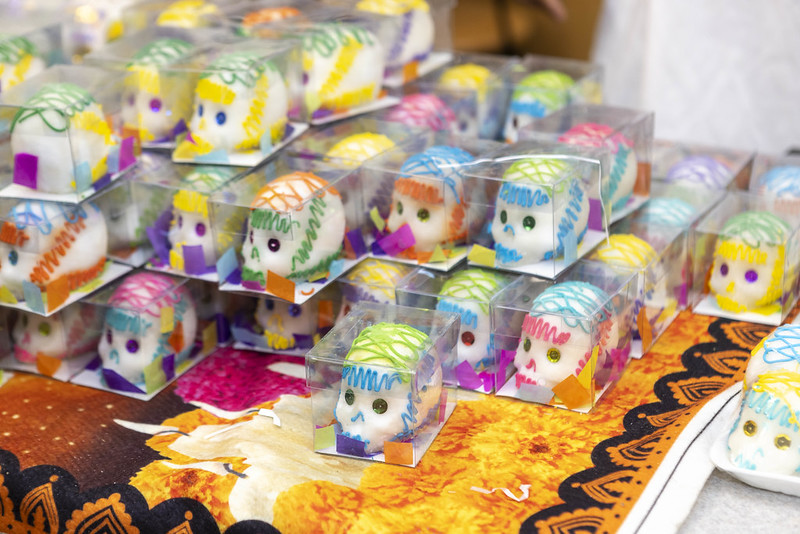 Colorful sugar skulls in boxes.