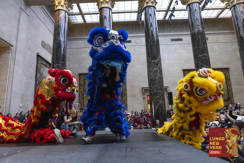 Three groups perform a traditional lion dance