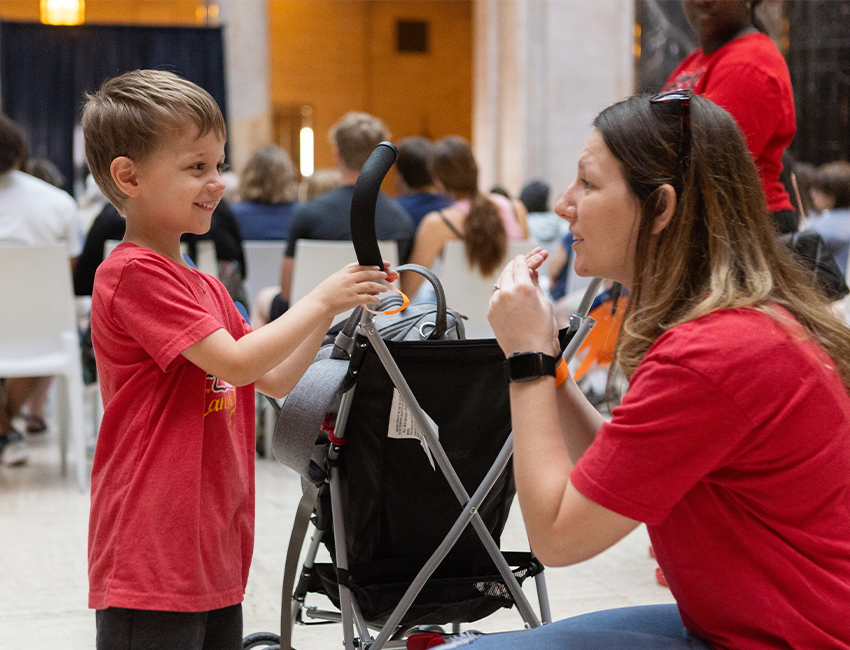 Image of mother and child interacting in gallery space
