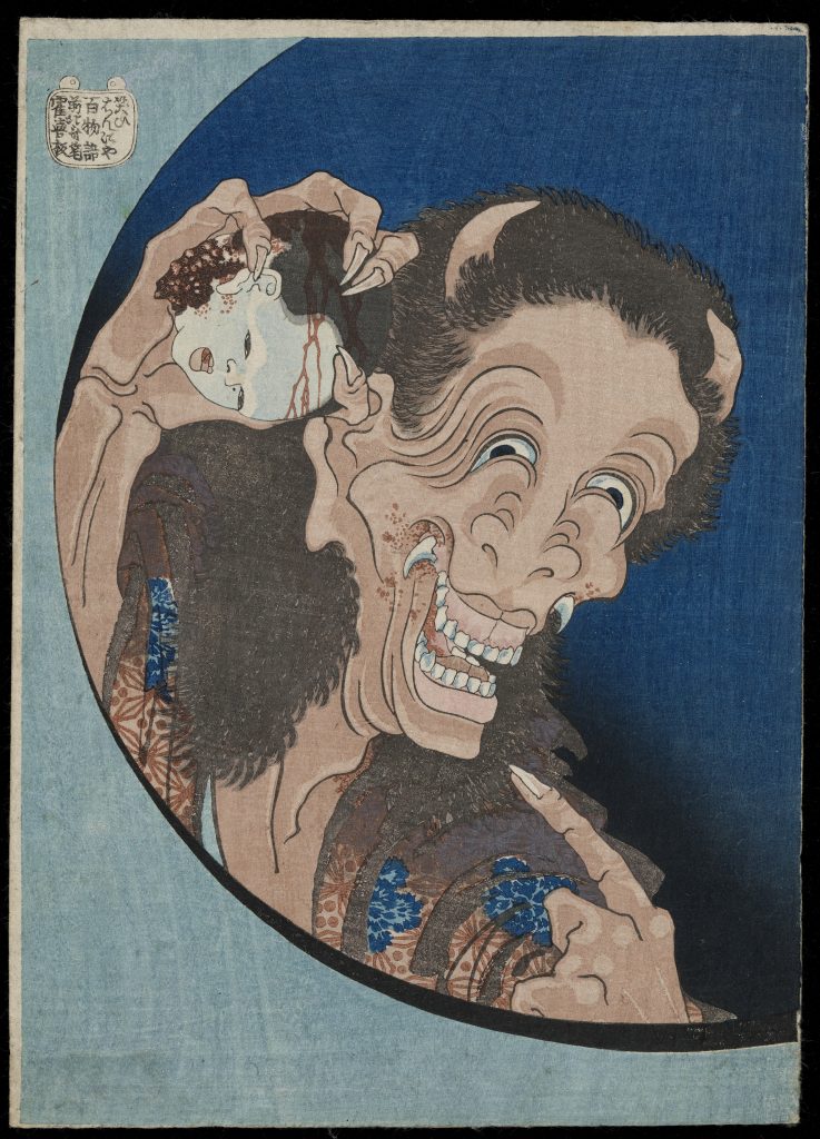 A smiling demon holds a bloody head.