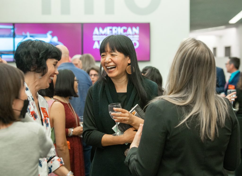 Guests enjoy conversation at an exhibition event for Nelson-Atkins Society of Fellows and Business Council members.