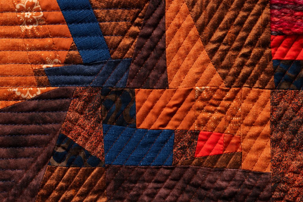 Up close picture of orange quilt