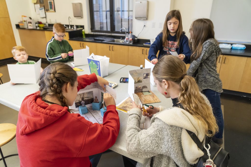 Young people participate in an art activity at the Nelson-Atkins.