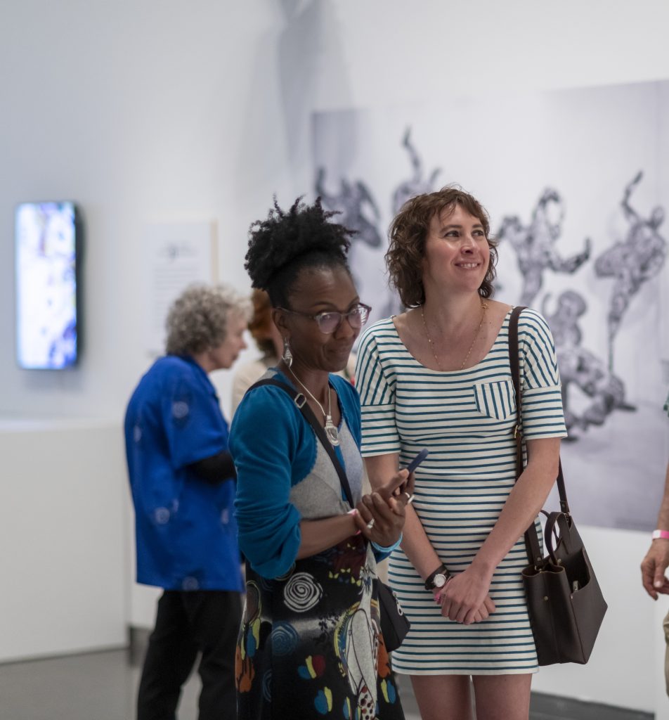 Two women gaze at art in a featured exhibition at The Nelson-Atkins Museum of Art,