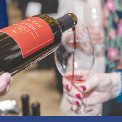 Wine being poured into a wine glass at ShuttleCork evening 2