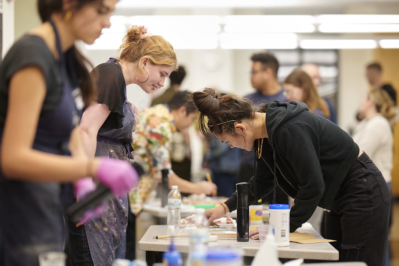 Guests interact with artists at a Night/Shift artmaking activity at the Nelson-Atkins.