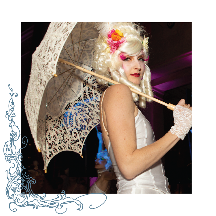 A guest dressed in Victorian costume poses with a parasol at the Nelson-Atkins Party Arty fundrasier.