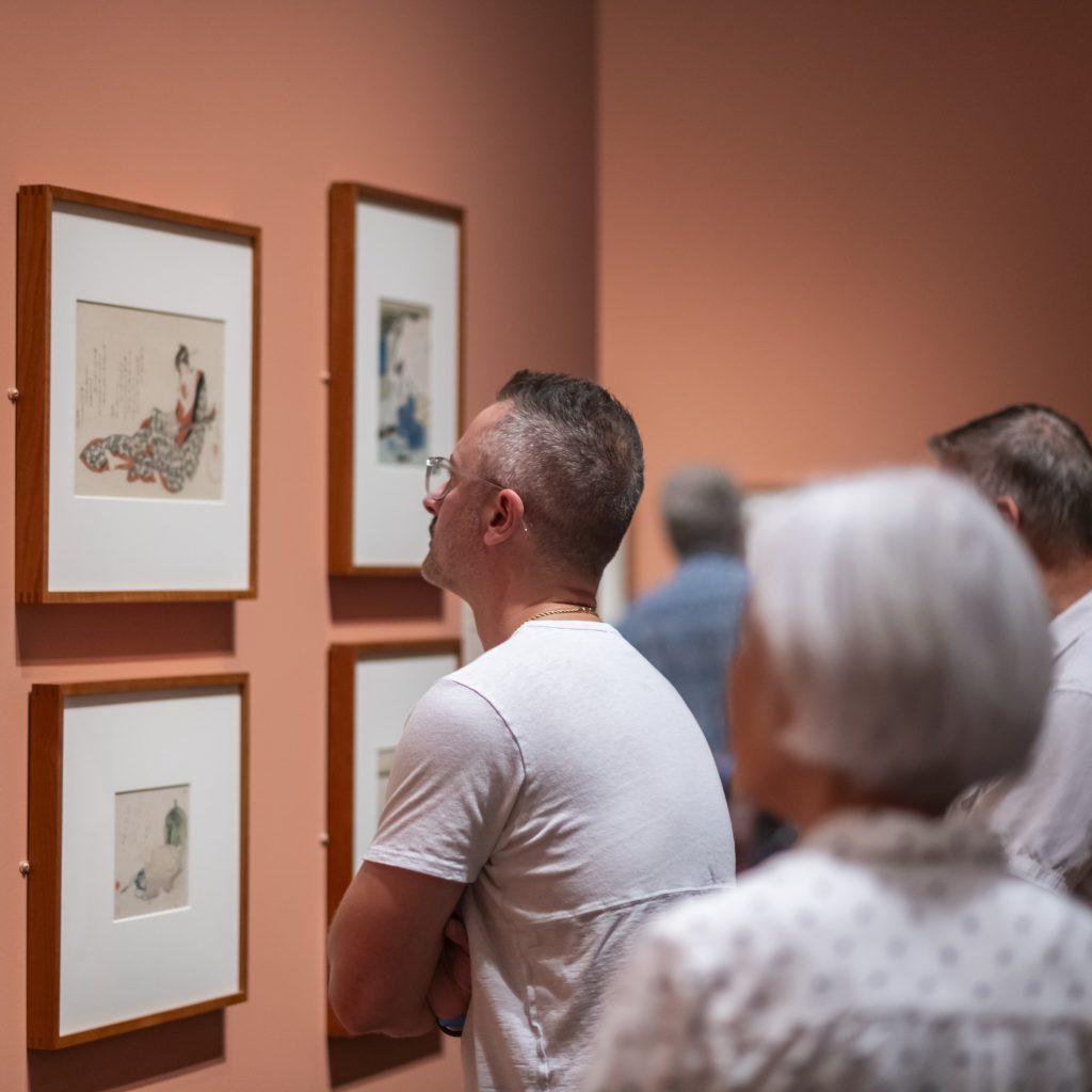 A man gazes at art on display in a special exhibition at The Nelson-Atkins Museum of Art.