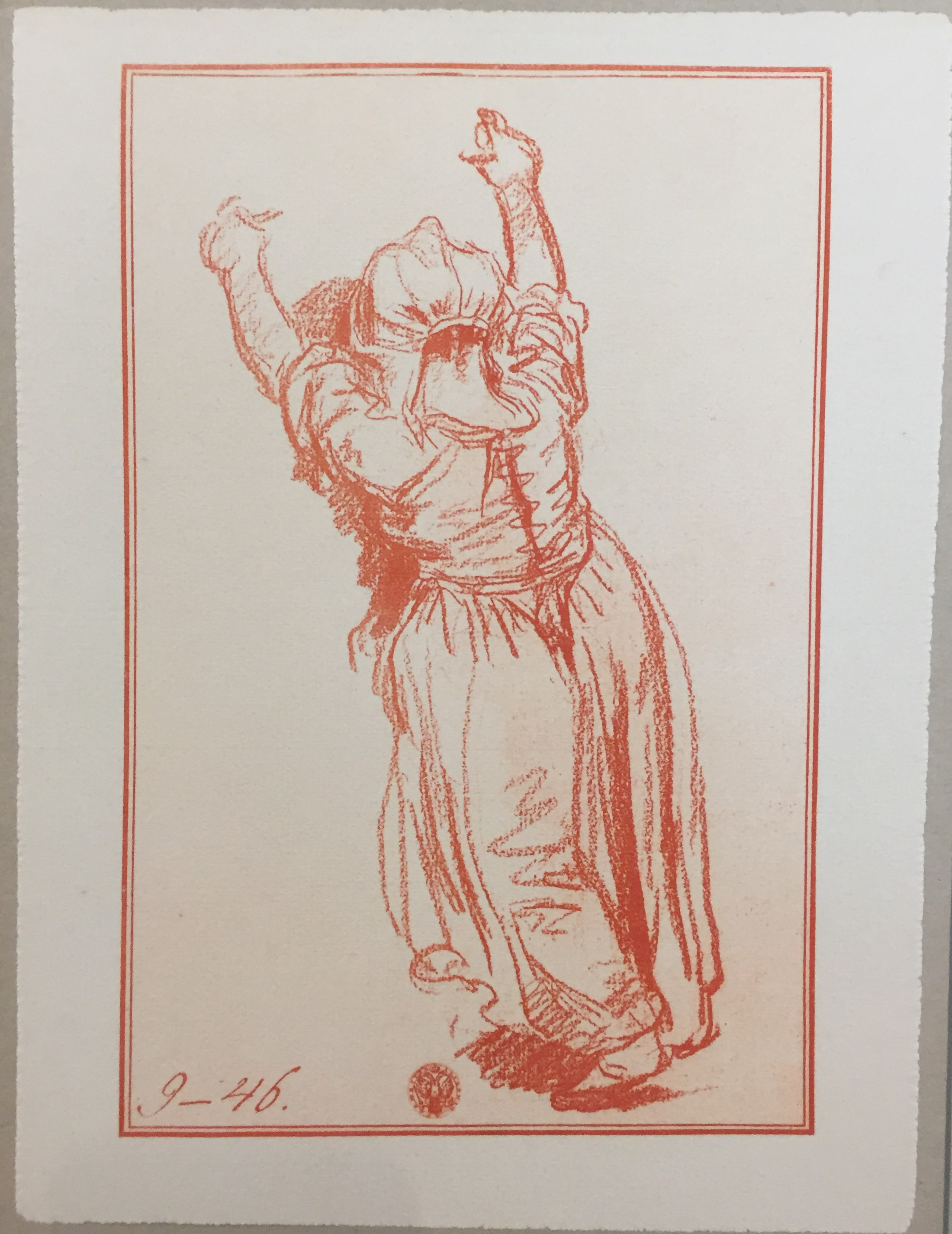 A photograph of a sketch depicting a young girl with her arms stretching above her head. She seems to be leaning her forehead against a larger figure. The child wears a dress, and she is drawn entirely in scarlet-colored strokes.