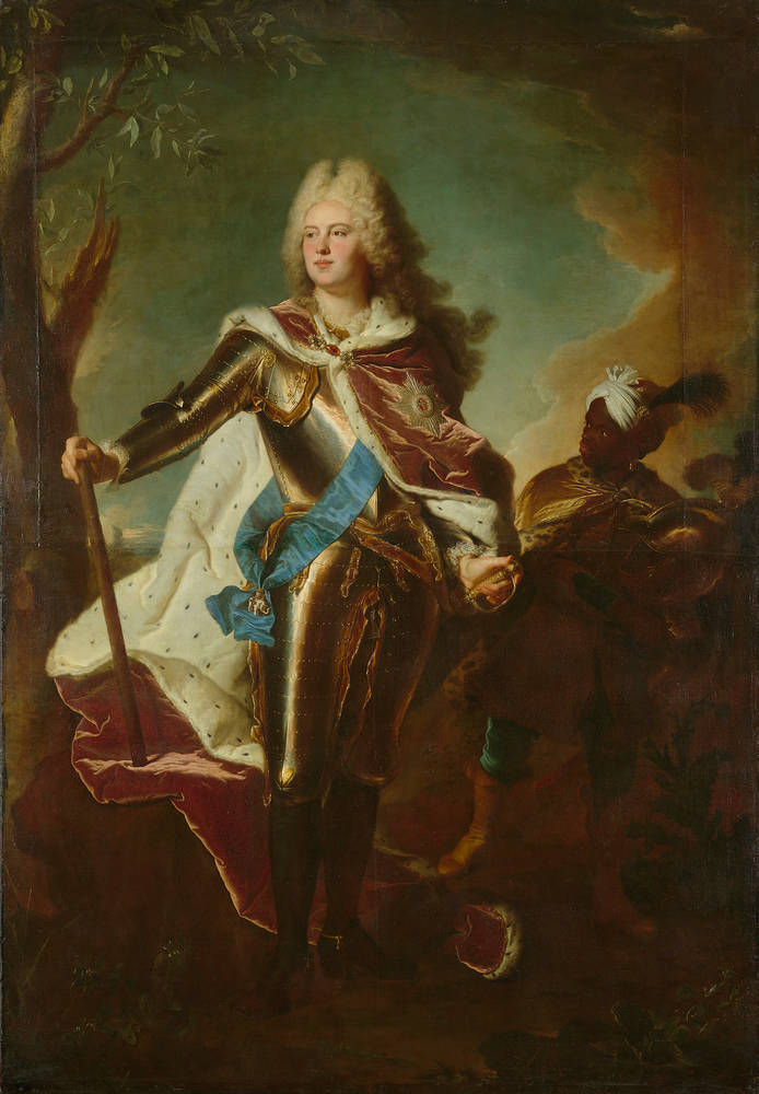 A painting of a pale-skin-toned man in reflective silver armor with gold accents around each plate’s edge. The man has a bright red cape wrapped around his neck and going over his back, while a blue stash crosses over their heart.  He holds a wooden stick in his right hand and has a golden hilt of a sword in his left hand. To the right is a dark-skinned man wearing a white cloth around his head and a cape with animal print around his neck. To the left is a tree with very few levels and branches. The background constants of gray and brown clouds covering a blue sky. On the ground, there is a variety of rocky terrain.