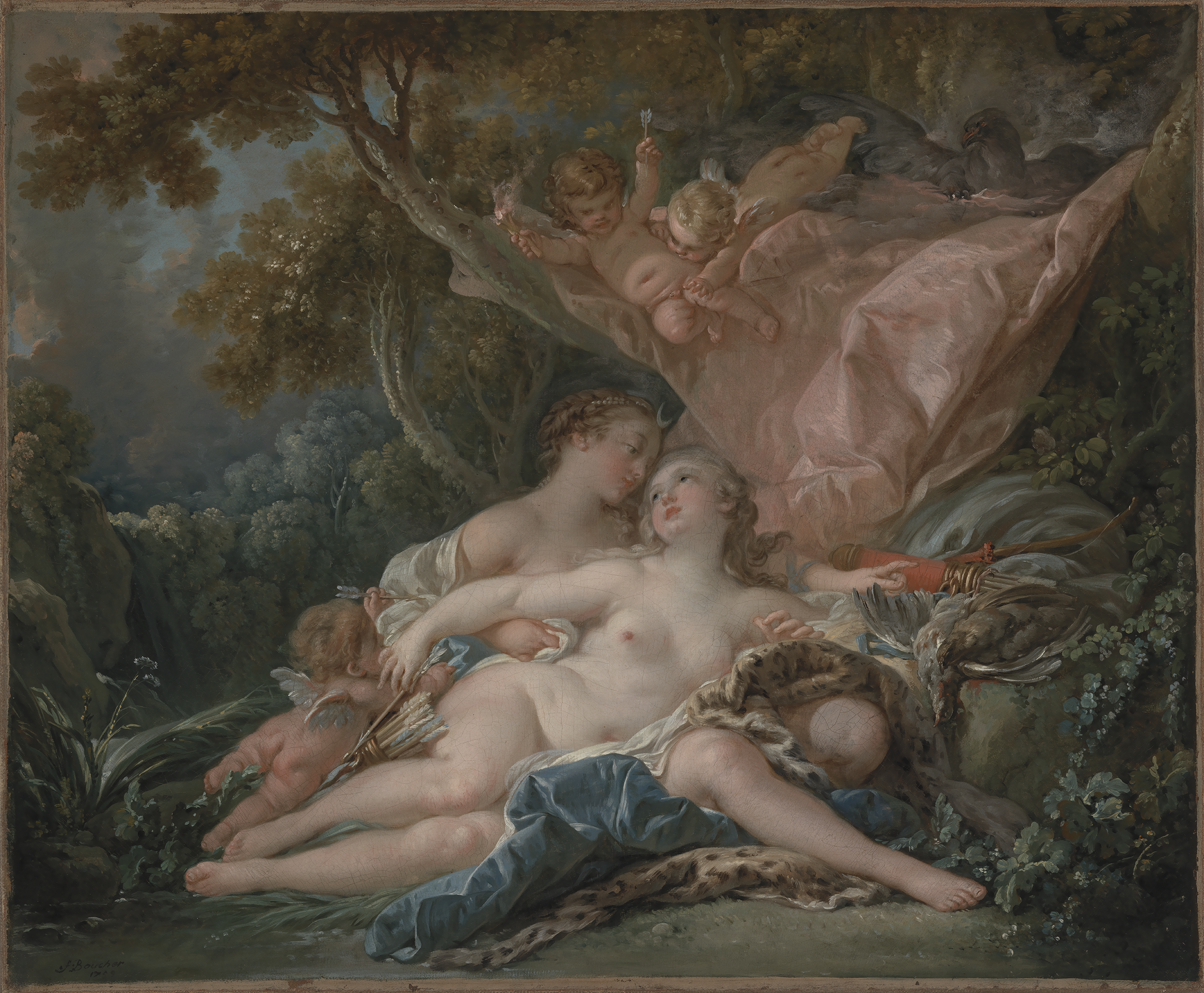 A painting depicting two nude women laying on the ground on a blue blanket and animal skin. Above them, there is a large pink blanket or cloth with babies with wings sliding off of it. In the background consists of a dense forest.