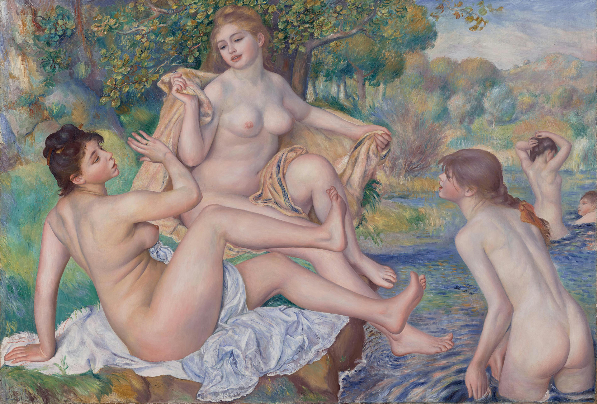 A painting depicting two nude women sitting on their towels on the edge of a river. To the right of them another naked woman stands in the water facing them. Behind her, there are other women cleaning themselves in the water. In the background there is a forest full of green trees.
