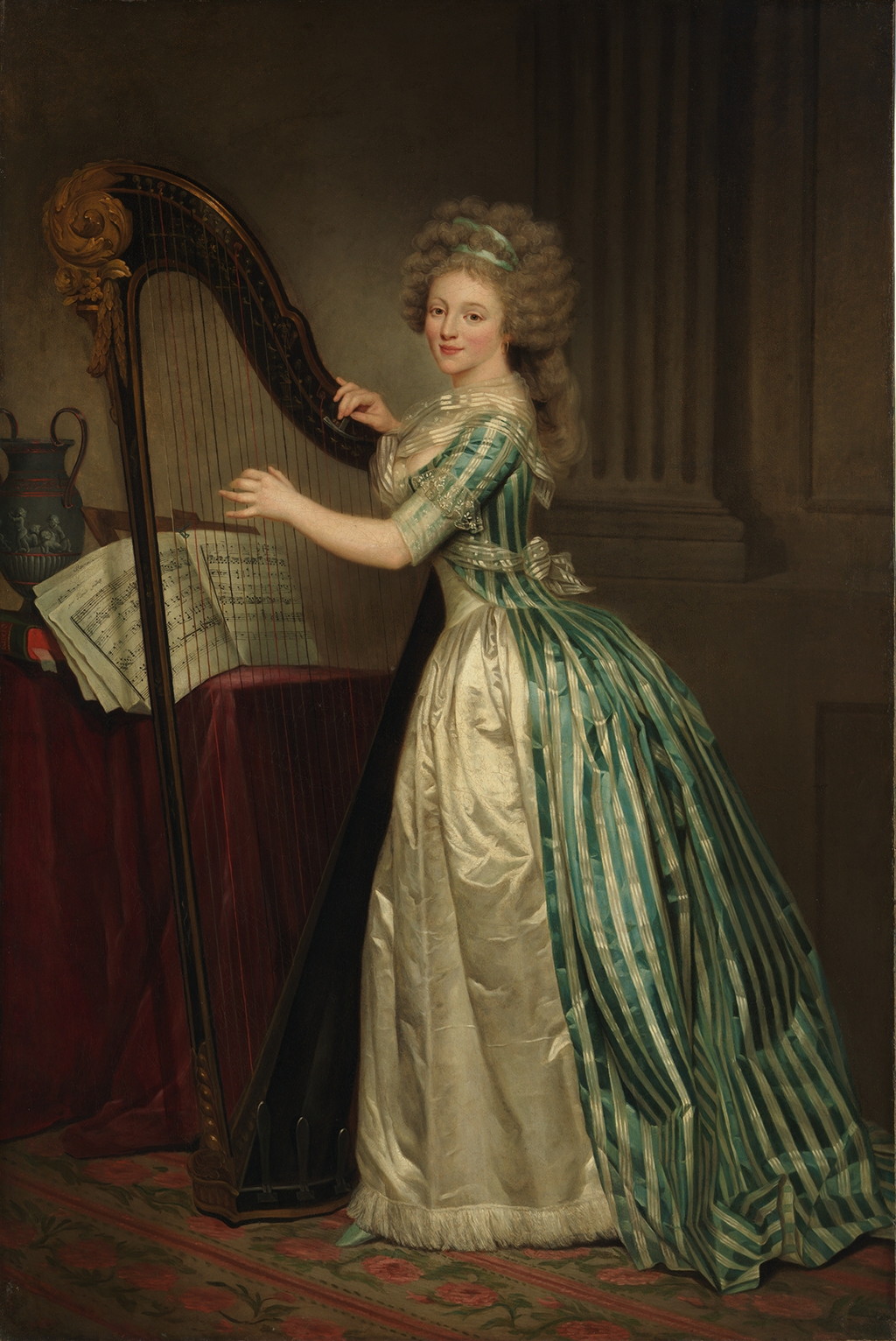 A full-length painting of a woman standing before a black harp. She wears a green and beige striped dress and has powdered hair tied up in a green ribbon. She strums the strings of the tall black harp with gold accents. Behind the harp is a table draped with a red velvet cloth upon which is a black Grecian vase and sheets of music. She stands on a rug that patterned with red flowers and red stripes.