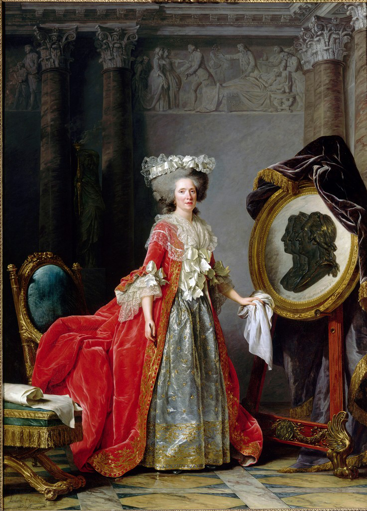 A painting depicting a lightly skinned tone woman wearing a large red dress filled with golden accents and white silk clothes around her neck and arms. The woman wears a white cloth or headdress on top of her large gray hair. Her red dress also rests on top of a golden chair with a turquoise fabric. She also holds a white cloth against a sculpture that has three faces carved that is covered with a large purple drape. The background consists of pillars and columns with figures who have been carved into the wall.