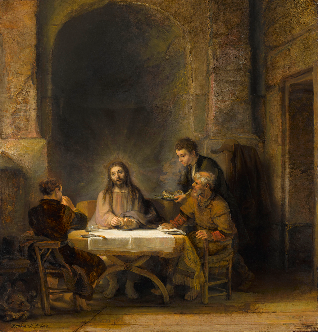 A painting depicting a man with long brown hair with robes sitting at a table. His hands are resting on a loaf of bread. Around him, are three figures watching him while they eat. Two of them sit on wooden chair while one stands holding a plate with more food. They are under an arched hallway.