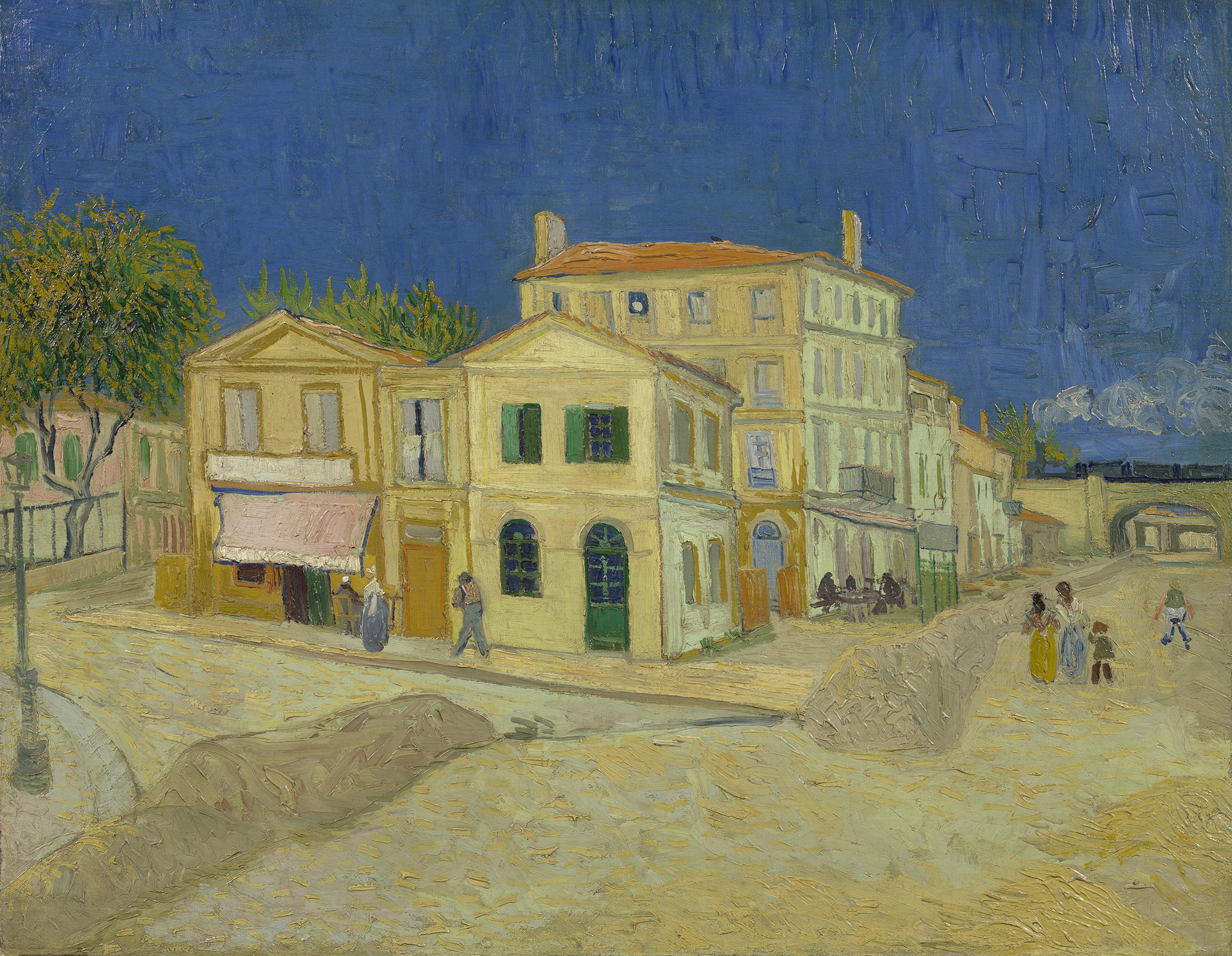 A painting of a street corner with buildings bundled up together overlooking the road and sidewalks that surround them. The buildings are colored in a yellow and a light green. People are walking along the sidewalk and on the road. In the background consists of a dark blue sky along with steam or smoke from a chimney.